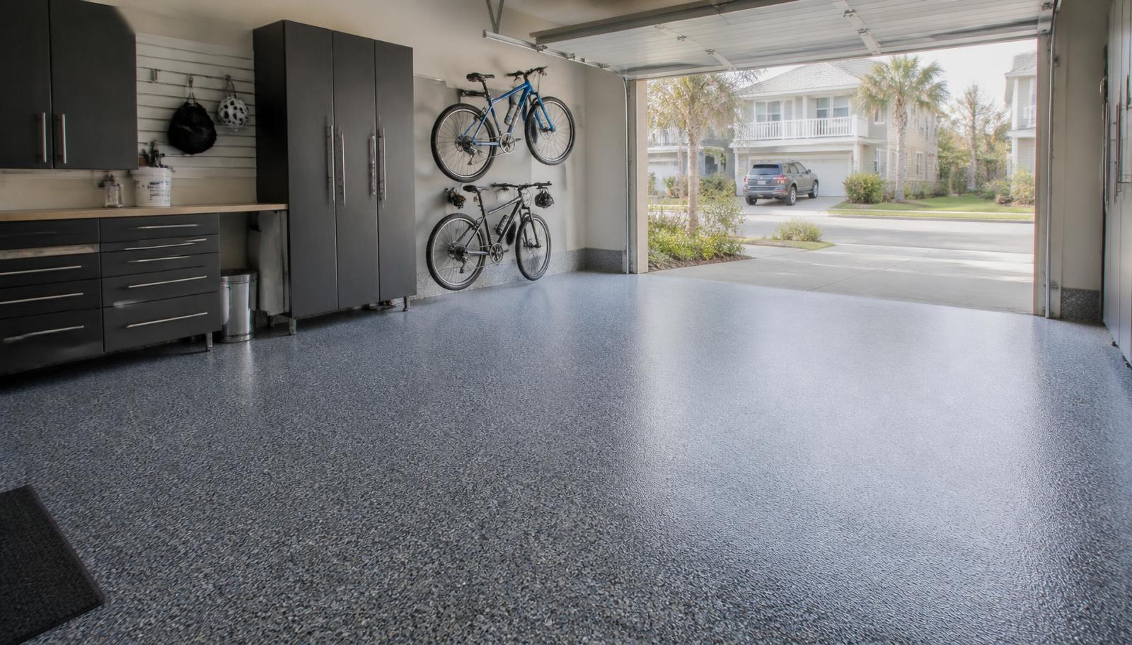 Finished gray flake epoxy floor in a residential two-car garage on the Grand Strand